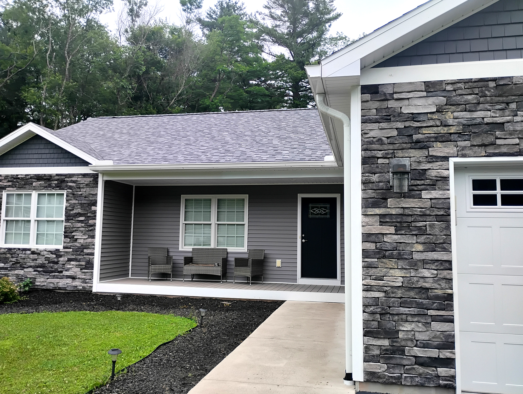 residential siding fake stone and aluminum plastic new build